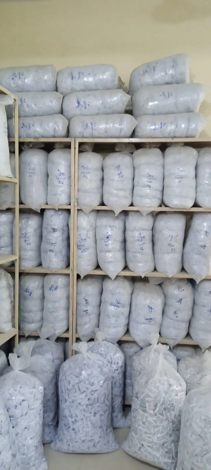 Shelves of bagged and labelled finished silica gel sachets in the DryGelWorld store room